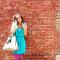 Loralei is wearing the envy dress by Lush and carrying the hazel handbag by Vieta for bellamaven.com