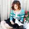 Loralei wears the envy sweater by Lush and carries the woven bucket handbag by Nila Anthony for bellamaven.com